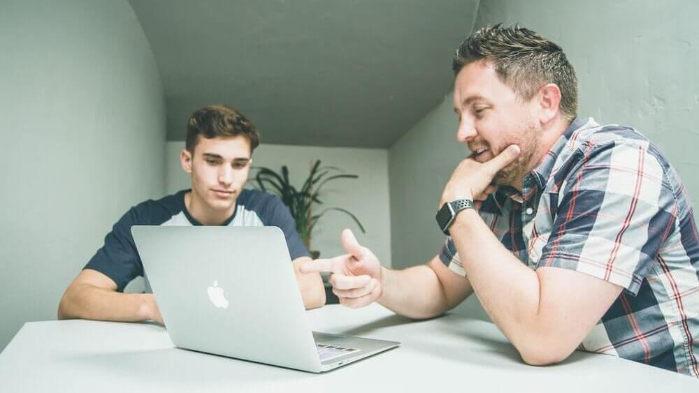 student studying on laptop with tutor